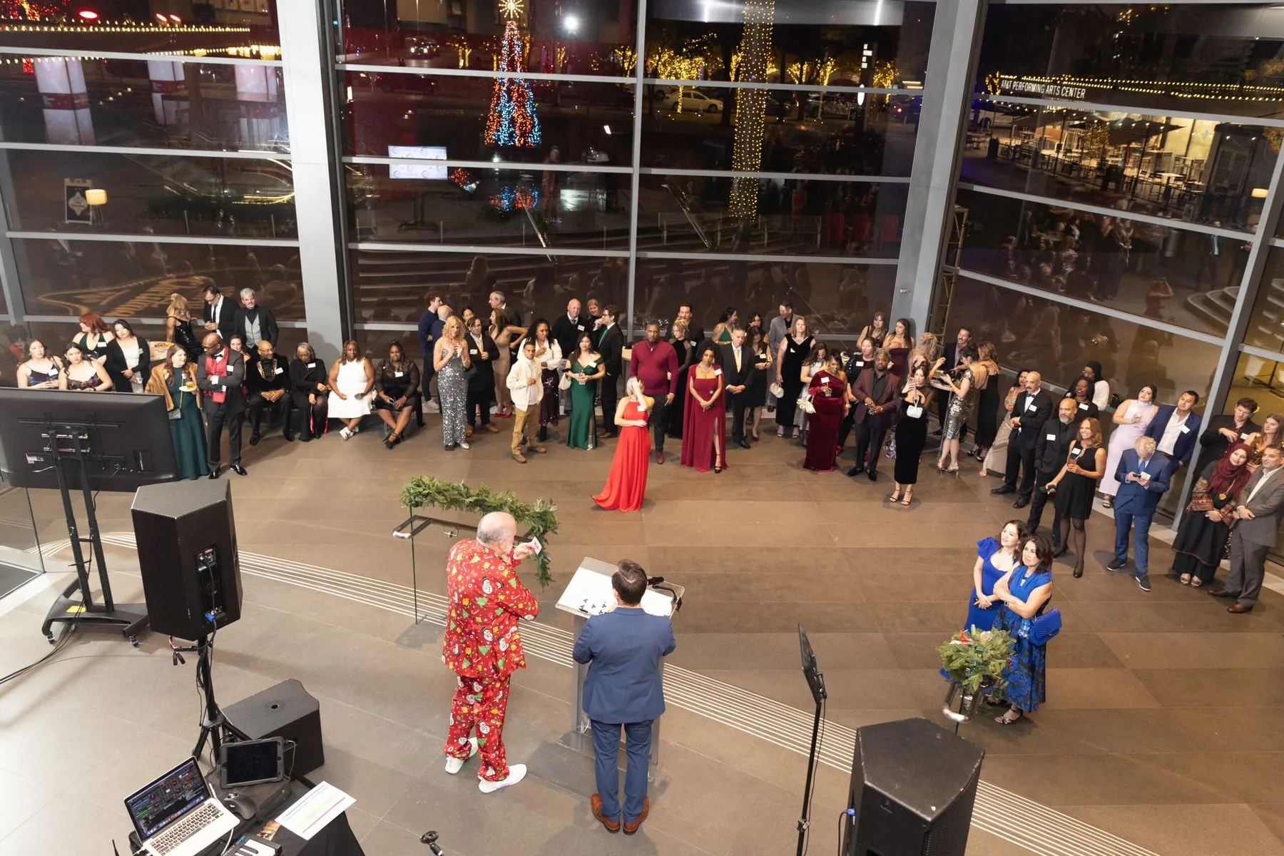 Brian Masters performing his stage show for a full room at a holiday party