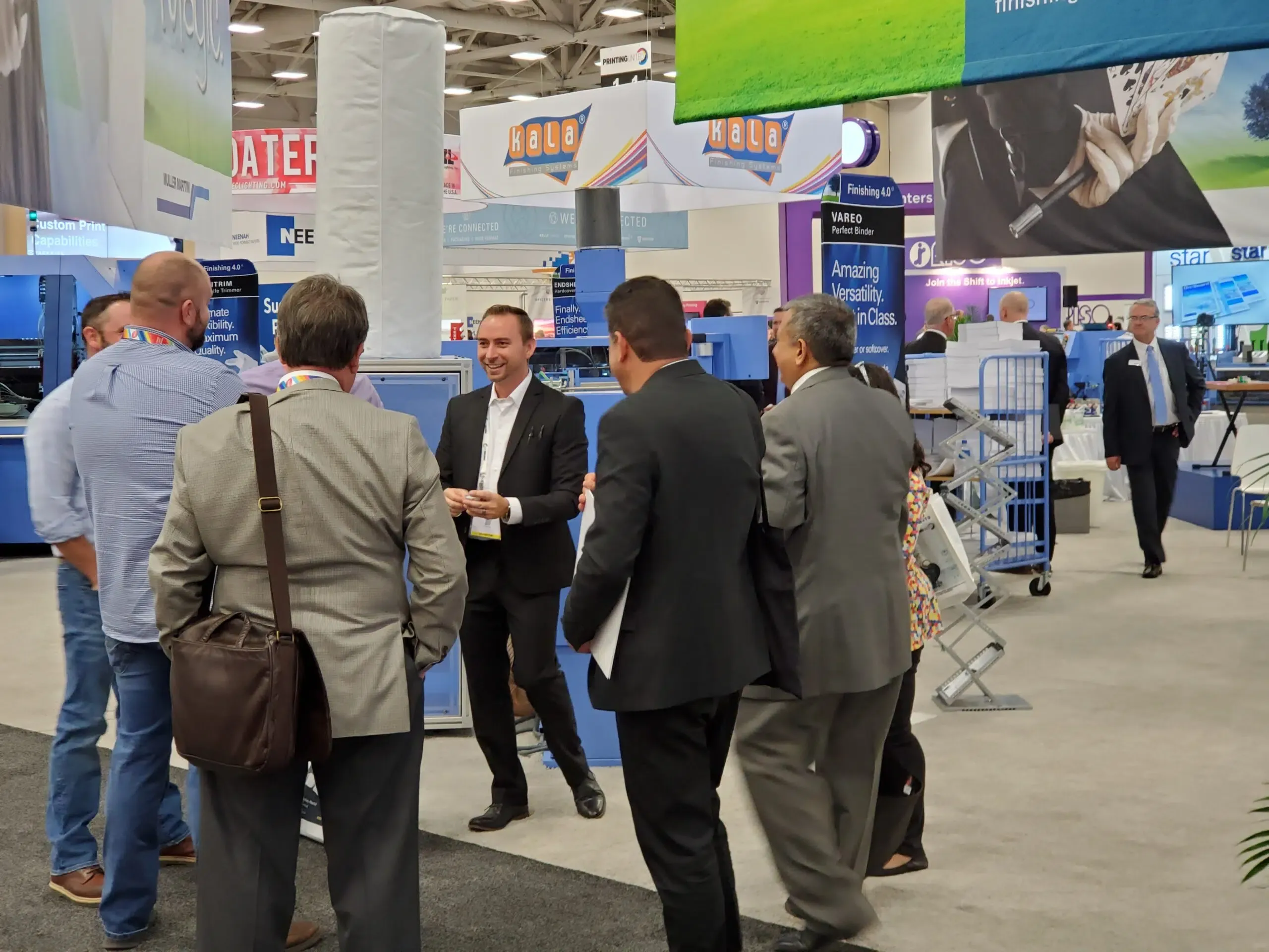 Brian Masters performing magic for visitors at a trade show booth